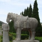 Stone horse and headless statue