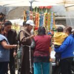 Priest blessing cars
