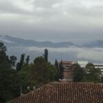 Clouds hills and rooftops