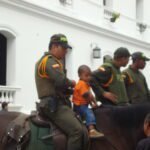 Little boy on police horse
